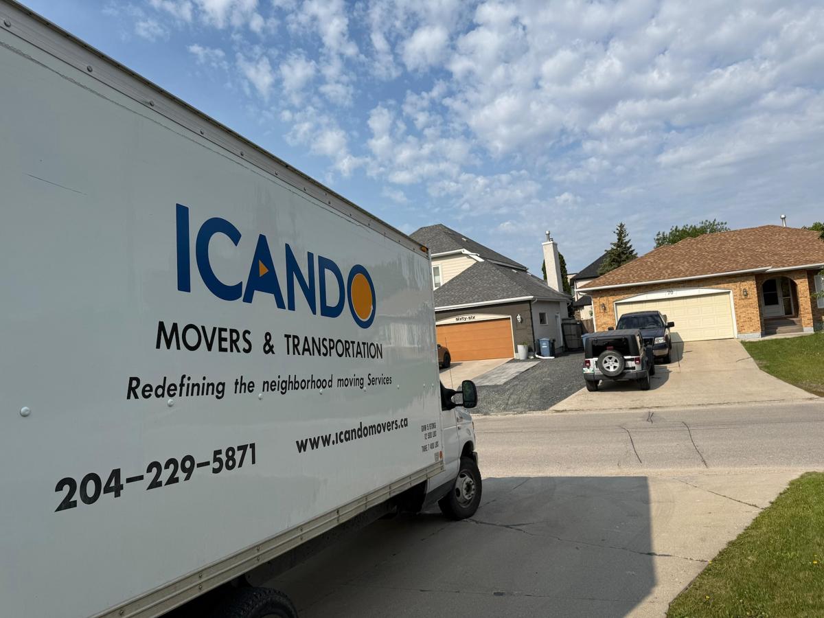 Icando Movers box truck on the road in Winnipeg